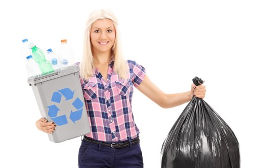 Operative wearing PPE while sorting commercial waste at site