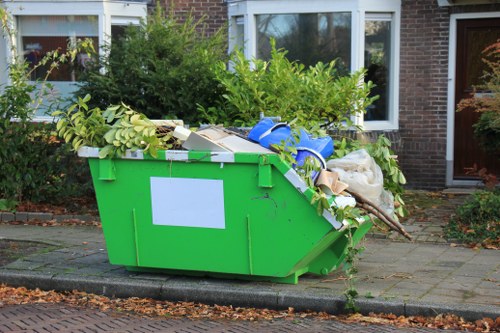 Workers sorting recyclables in a commercial waste area